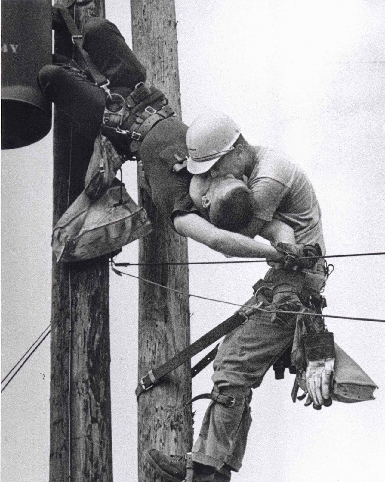 The Kiss of Life - A utility worker giving mouth-to-mouth to co-worker after he contacted a high voltage wire, 1967.jpg